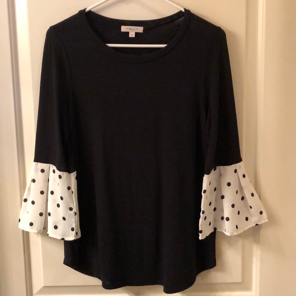 Black blouse with circular flounce sleeve